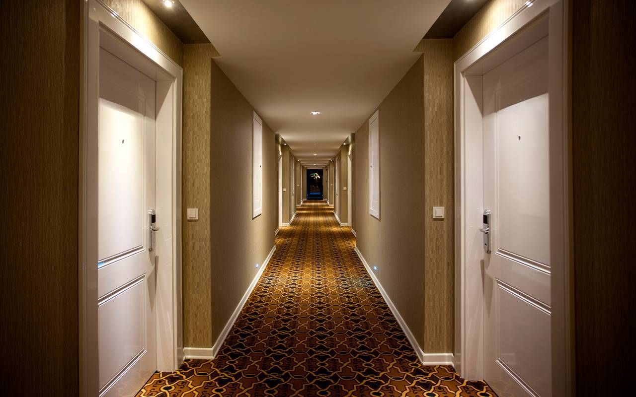 A photo of a hotel hallway. Next Avenue