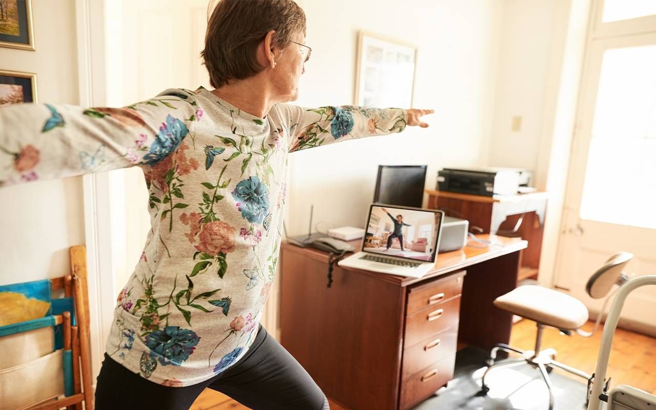 A woman doing yoga at home. Next Avenue, kegels