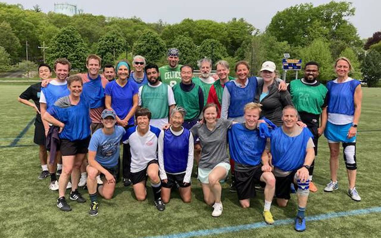 A multigenerational group of soccer players wearing jerseys. Next Avenue