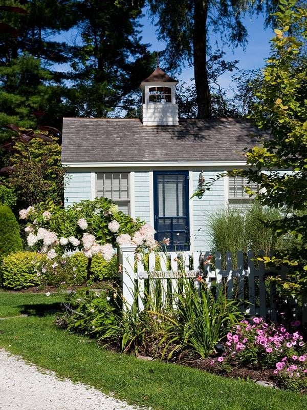 A picturesque cottage with a picket fence. Next Avenue