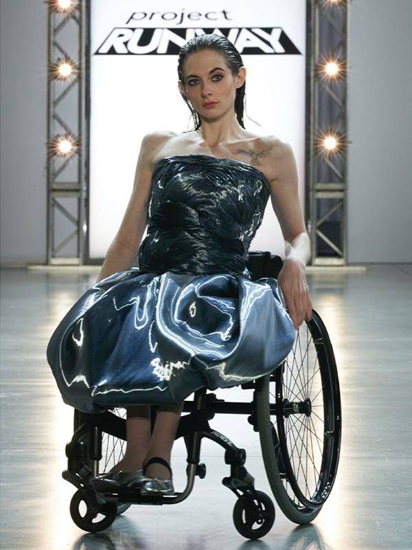 A model who uses a wheelchair modeling a gown on the runway for "Project Runway". Next Avenue