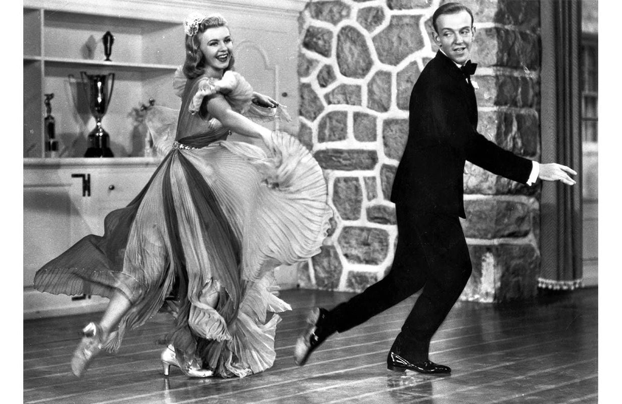 Ginger Rogers and Fred Astaire tap dancing together. Next Avenue