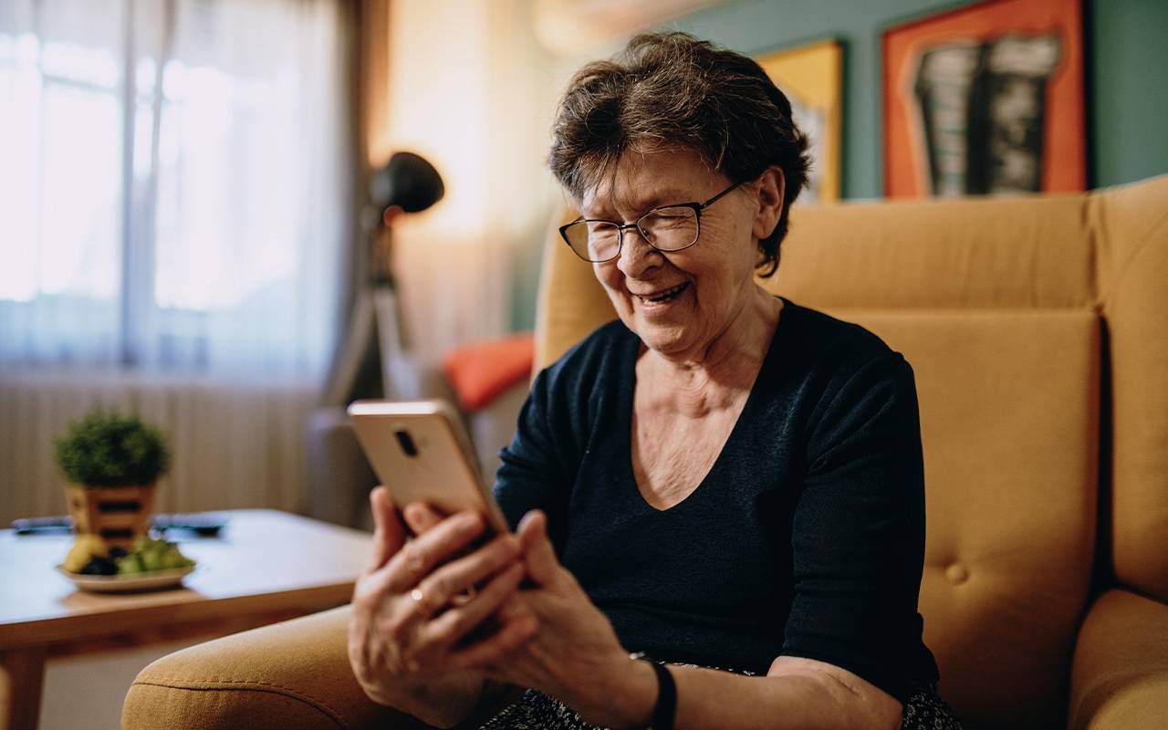 An older adult during a video chat. Next Avenue