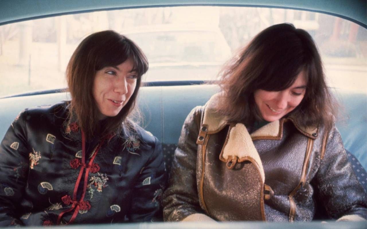 Two sisters laughing together in a car. Next Avenue