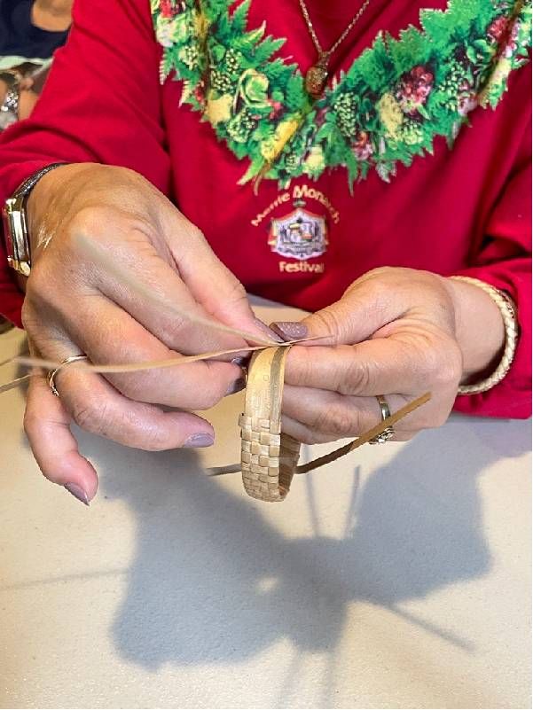 A close up shot of a person weaving. Next Avenue