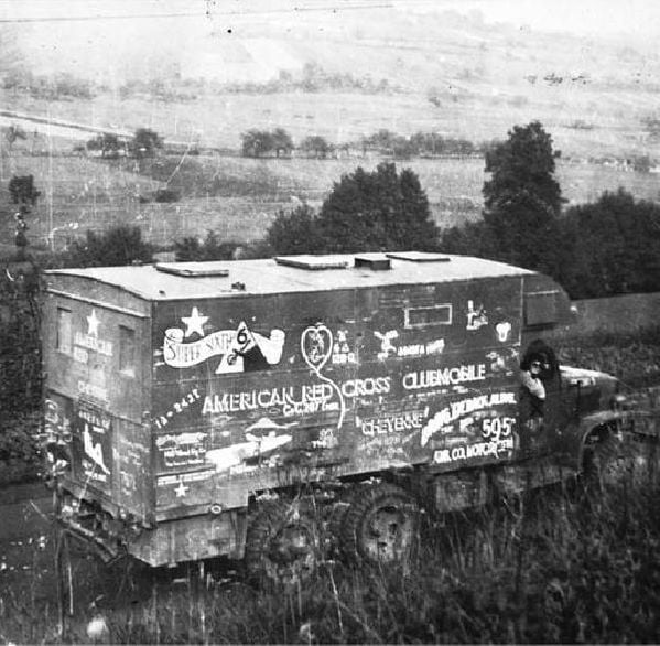 A vintage photo of a Red Cross truck. Next Avenue