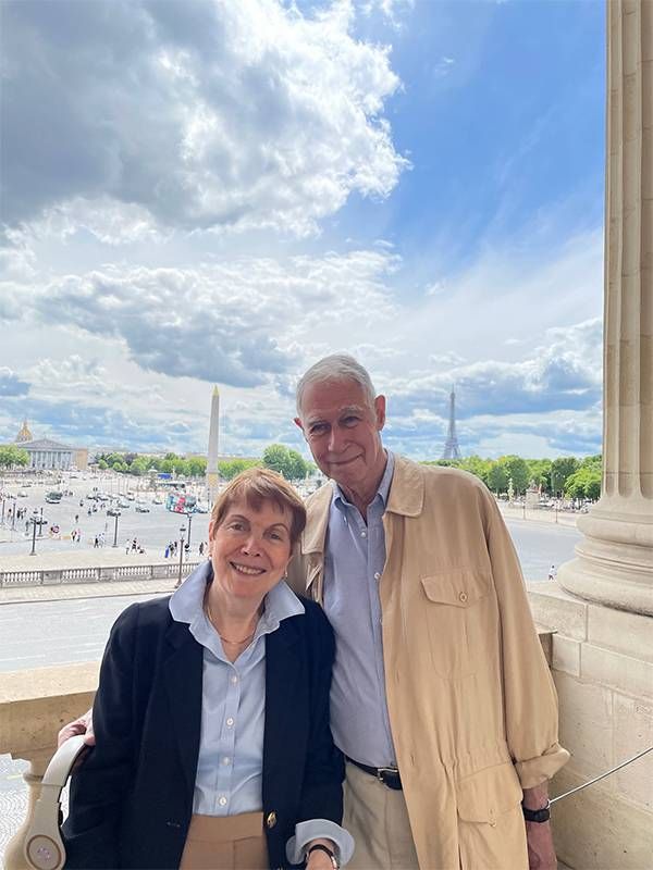 A couple smiling together in Paris. Next Avenue