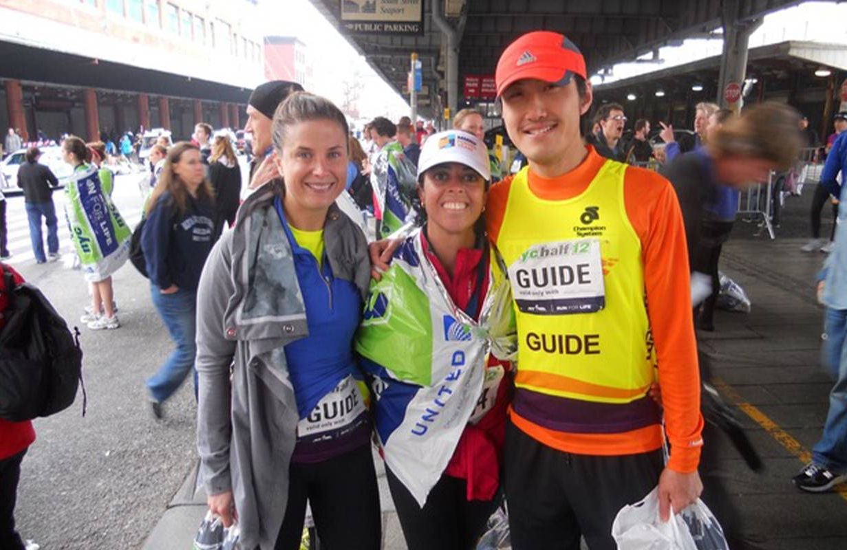 Three people smiling after completing a race. Next Avenue