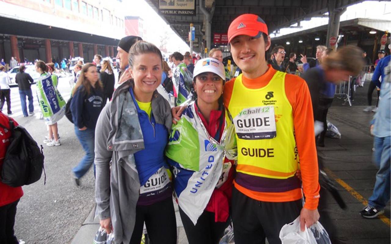 Three people smiling after completing a race. Next Avenue