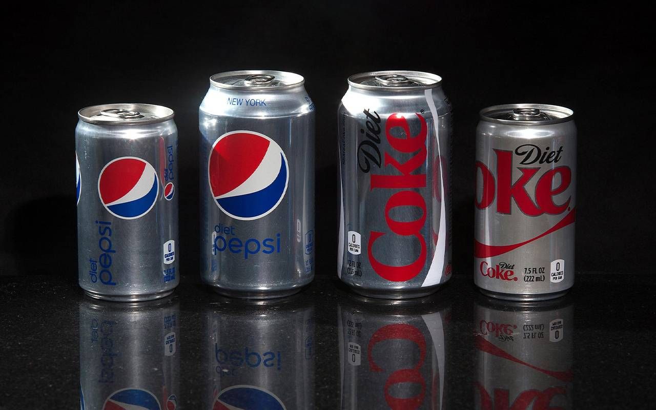Cans of diet Coke and Pepsi products. Next Avenue, aspartame, artificial sweetener, cancer