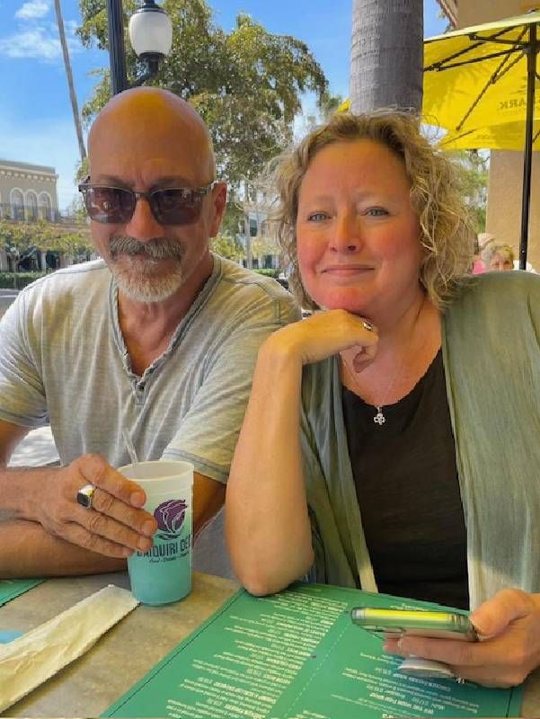 A couple at a restaurant smiling together. Next Avenue