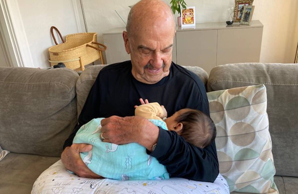 An older adult holding his great-grandchild. Next Avenue