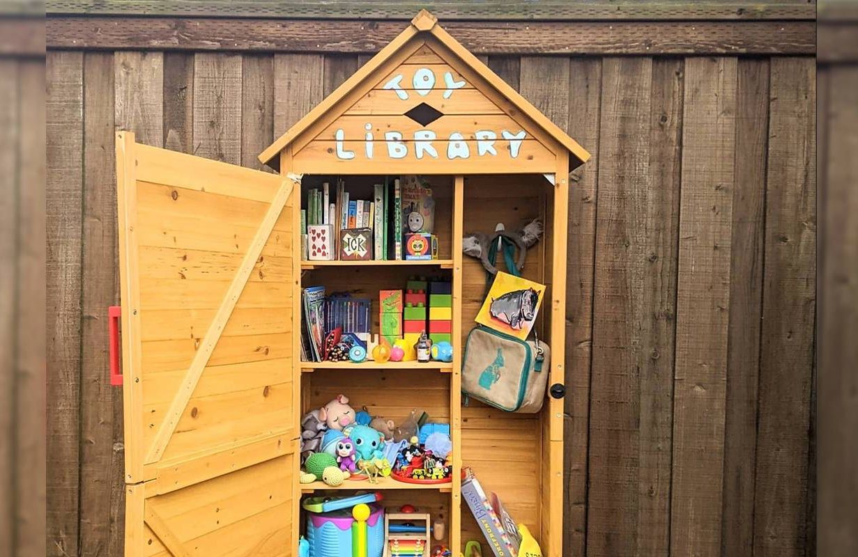 A large cupboard outside with children's toys and books inside. Next Avenue