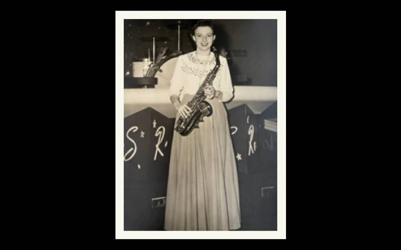 An old photograph of a woman holding her saxophone. Next Avenue