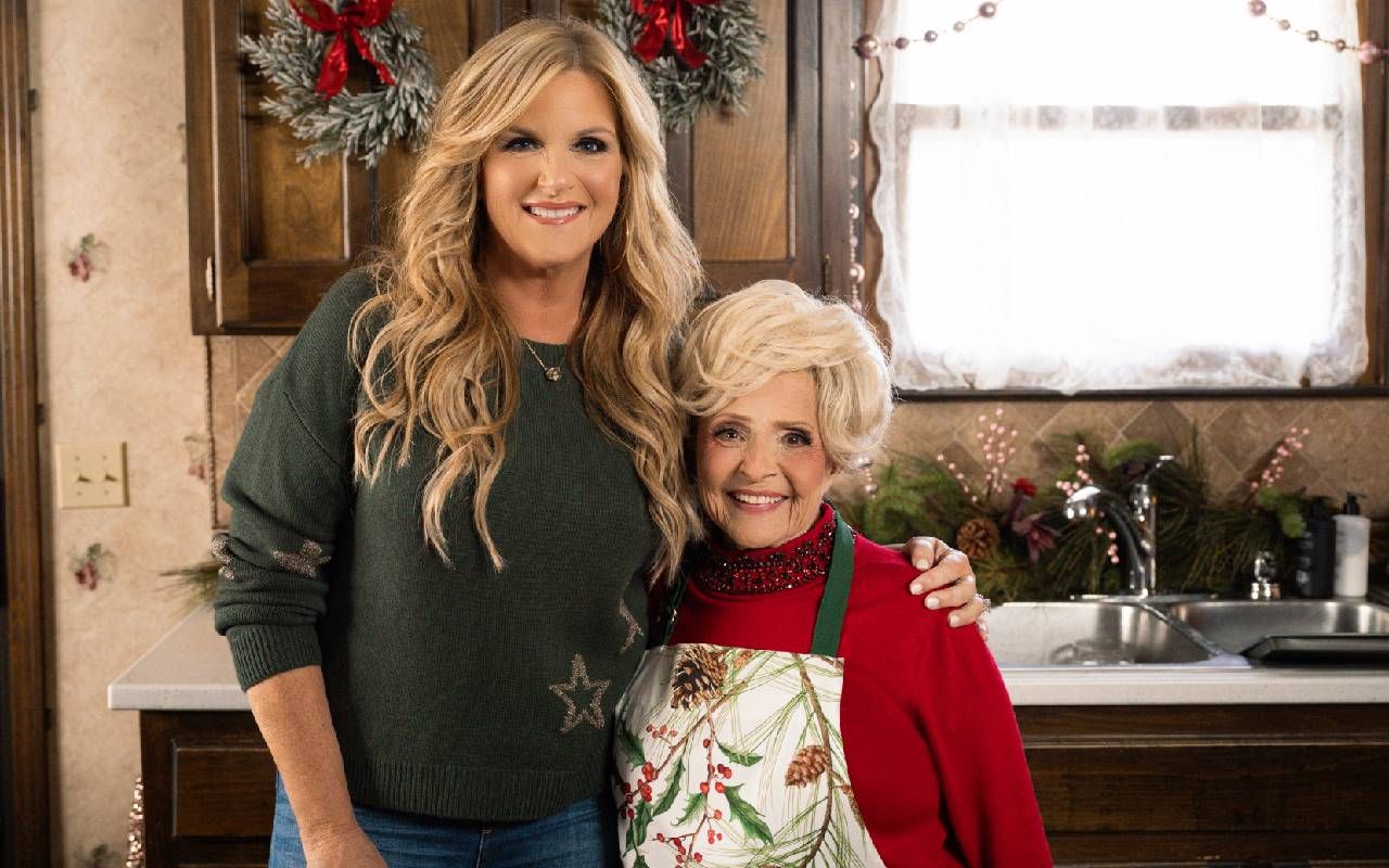 Brenda lee and Trisha Yearwood smiling in a kitchen. Next Avenue