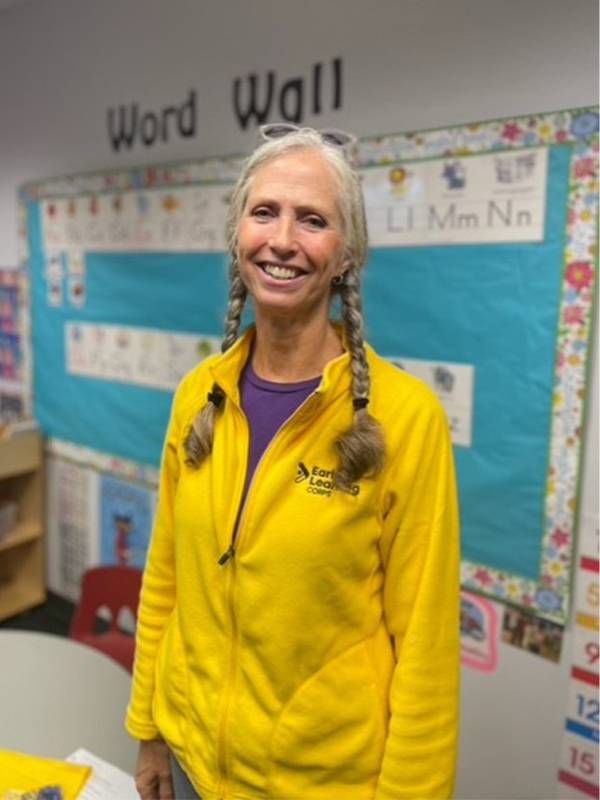 A woman smiling in a classroom. Next Avenue