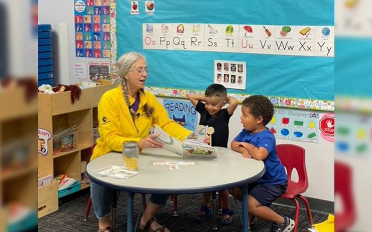 A woman reading to toddlers. Next Avenue