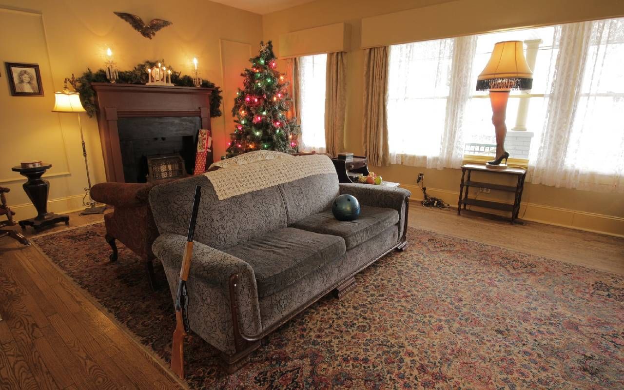Interior of a living room with a bb gun, a leg lamp and a bowling ball. Next Avenue, A Christmas Story House Tour