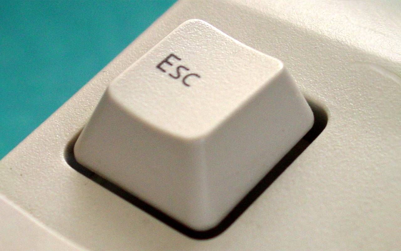 A close up shot of a escape button on a computer keyboard. Next Avenue, virtual, zoom