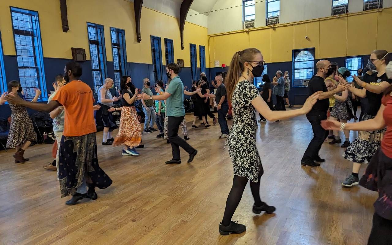 A group of people dancing. Next Avenue, contra dance