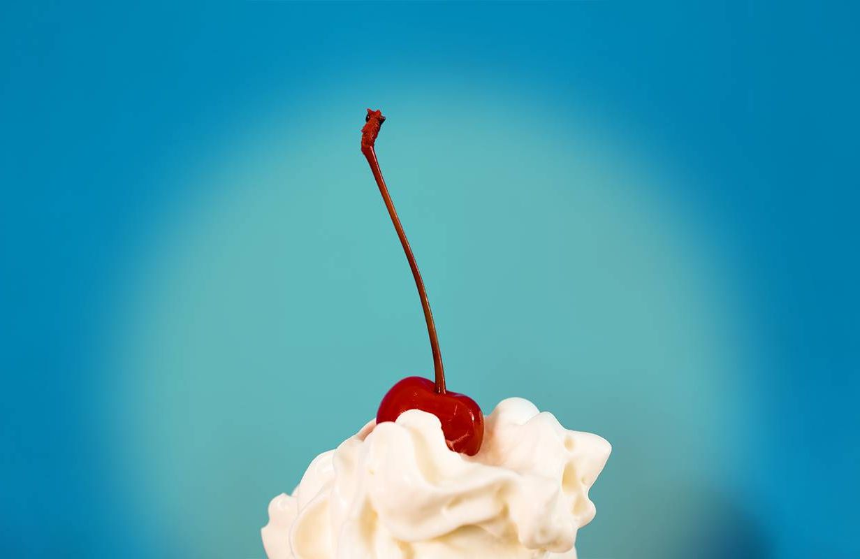 Whipped cream with a cherry on top. Christina Ward author of Book cover of Holy Food: How Cults, Communes, and Religious Movements Influenced What We Eat — An American History. Next Avenue