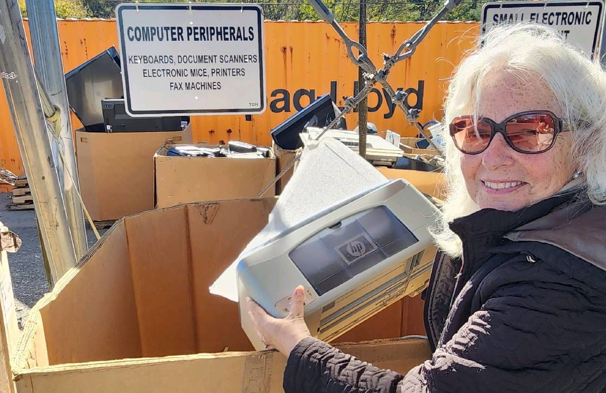 A person properly disposing of electronic waste. Next Avenue