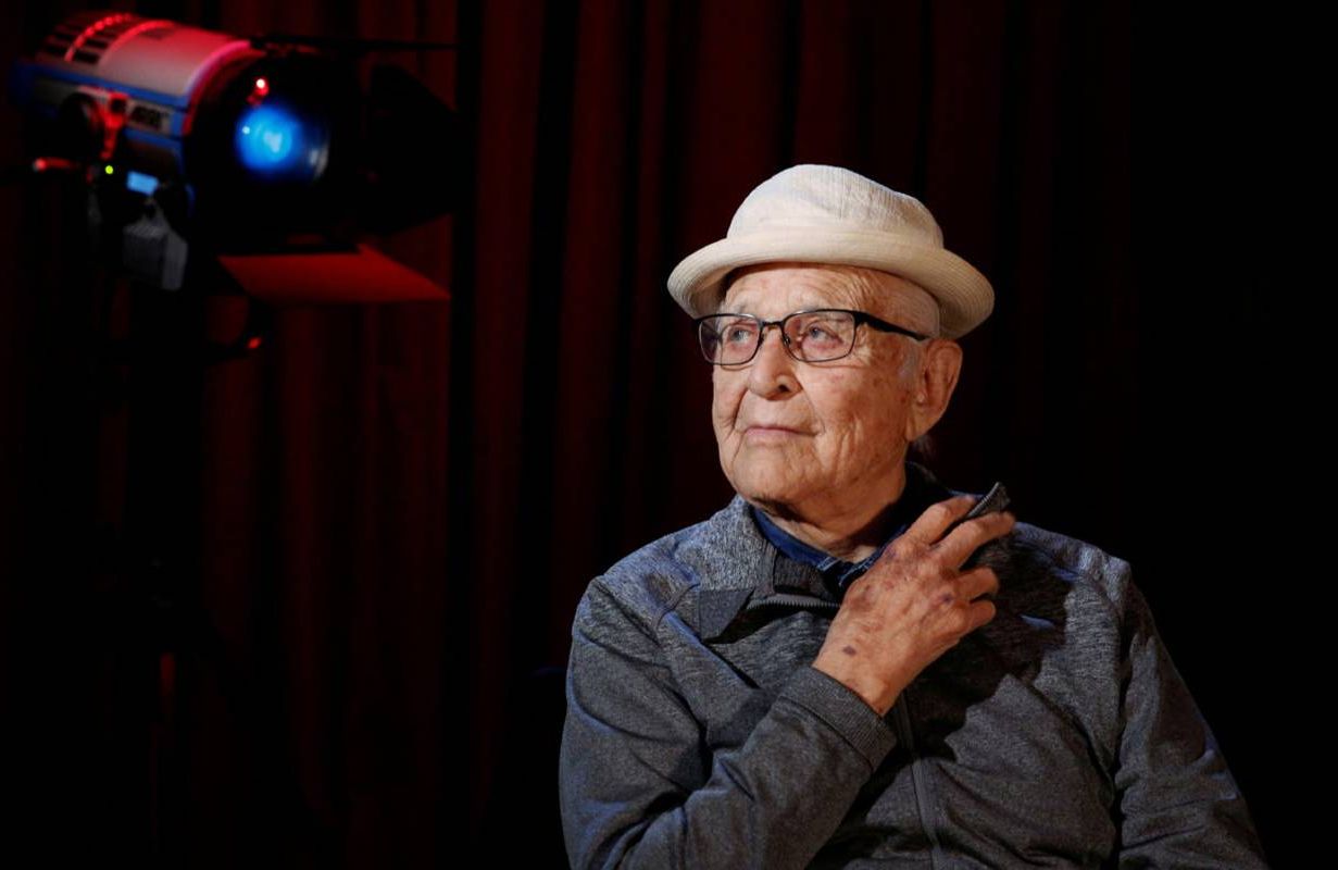 Norman Lear on a set wearing a hat. Next Avenue, Normal Lear