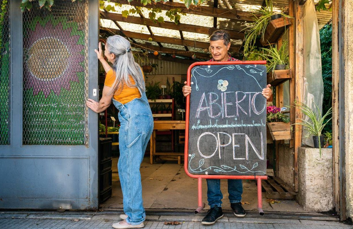 Small business owners opening up their shop. Next Avenue, entrepreneurship stress