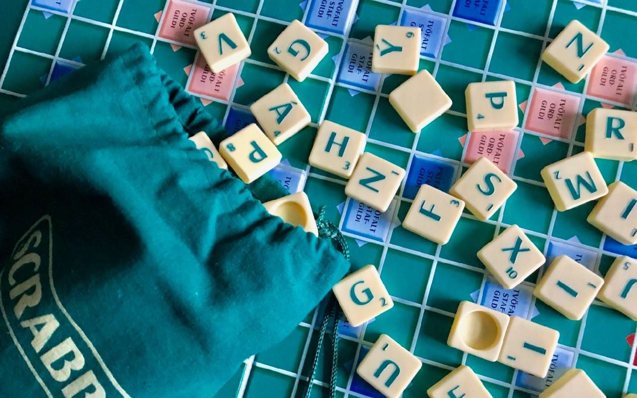 A vintage scrabble board and letters. Next Avenue, generations, board games