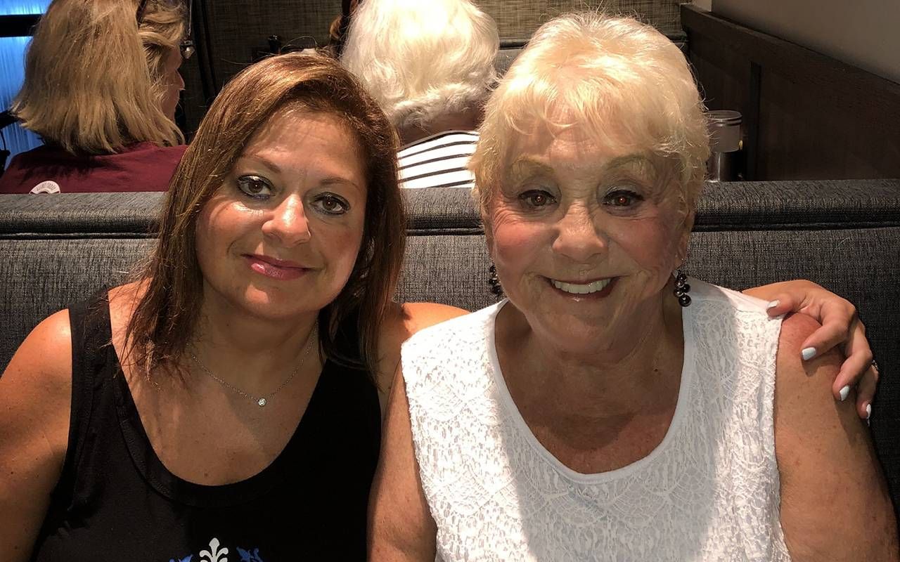 Two women smiling in a restaurant. Next Avenue, probate, heirs, estate planning