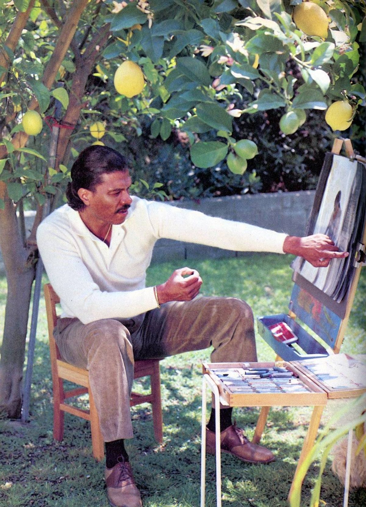 Billy Dee Williams paints in a vintage copy of GQ