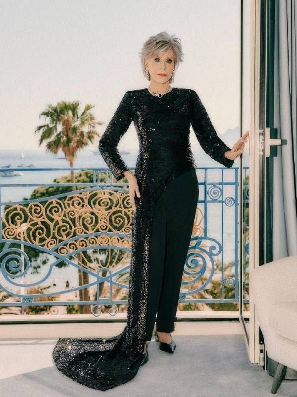 Jane Fonda wearing a black sequined pantsuit. Next Avenue