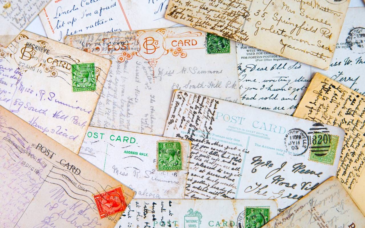 A pile of vintage handwritten postcards. Next Avenue