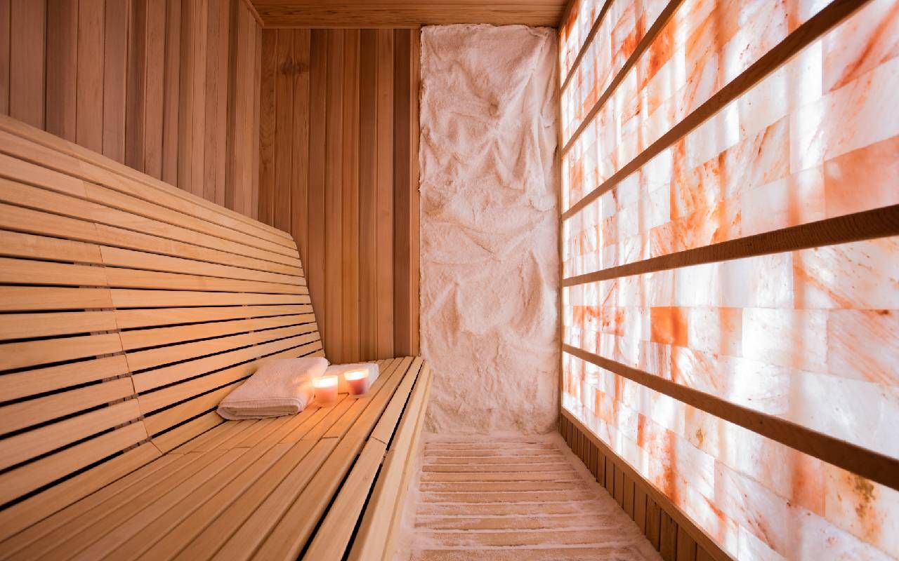 A room with an entire wall made up of Himalayan salt bricks. Next Avenue, salt therapy