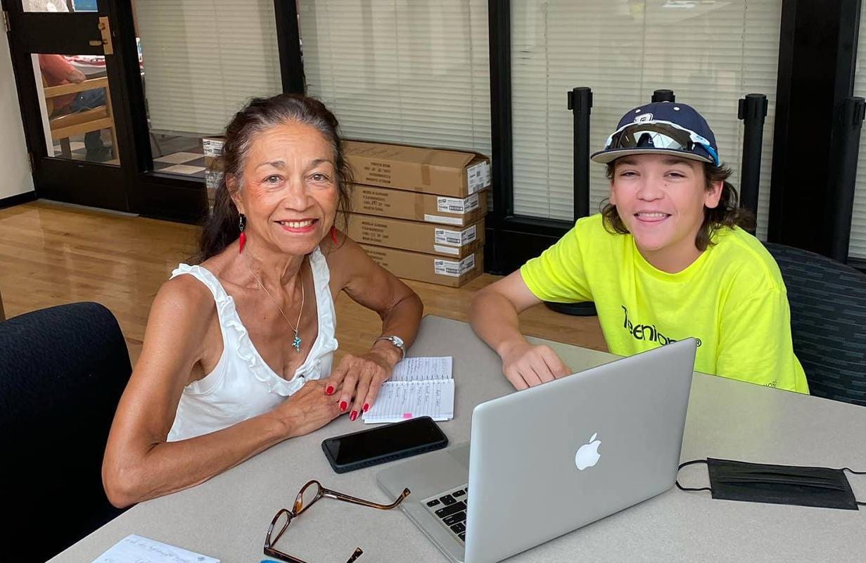 A young person tutoring an older adult. Next Avenue, digital buddy, social connection