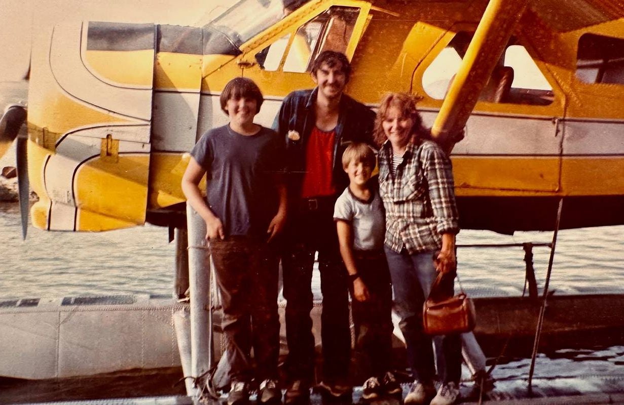 A vintage photo of a family smiling in front of a float plane. Next Avenue, second act career