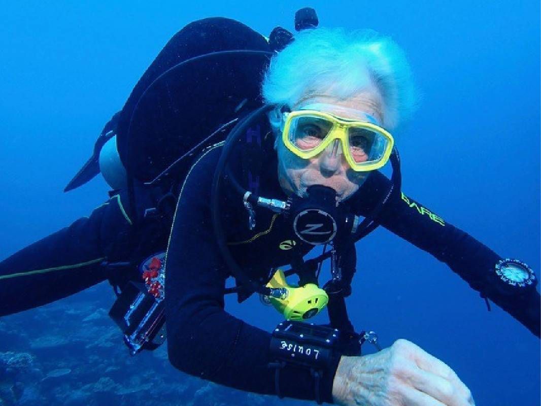 An older woman underwater during a scuba dive. Next Avenue, tough broad