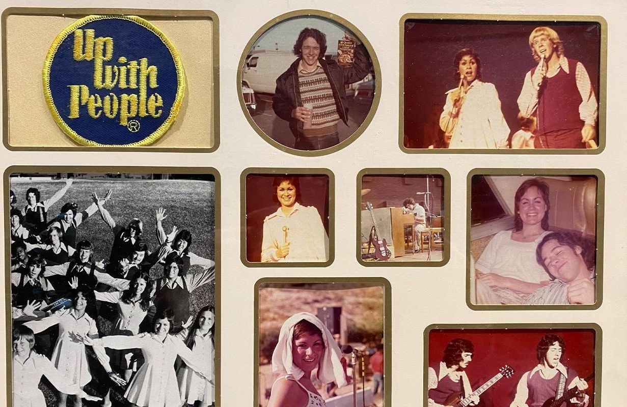A photo album with vintage photos of 'Up with People.' Next Avenue