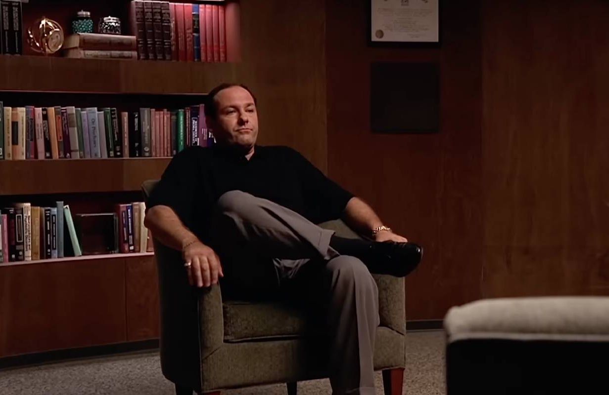 A still from The Sopranos with Tony Soprano sitting in a chair in his therapist's office