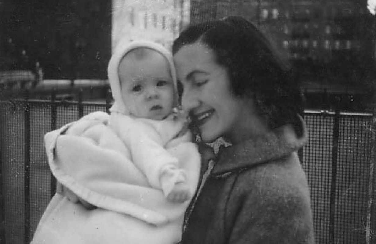 A black and white photo of a woman holding a baby. Next Avenue, mother, grandmother, relationship