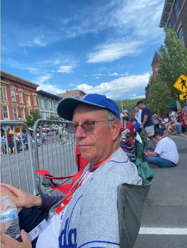 Headshot of a man watching a parade. Next Avenue, perception of aging, ageism