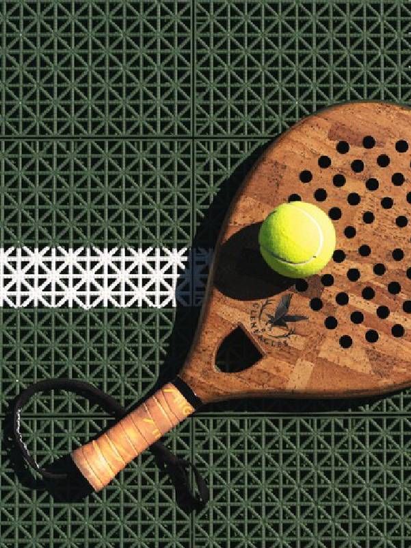 A close up shot of a padel racket and ball. Next Avenue