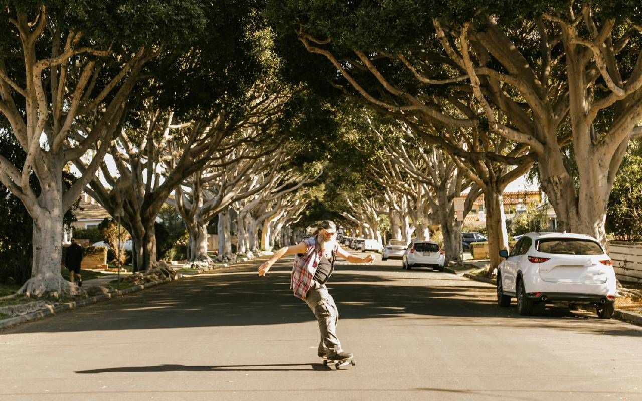 An older man enjoying life and skateboarding outside. Next Avenue, perception of aging, ageism