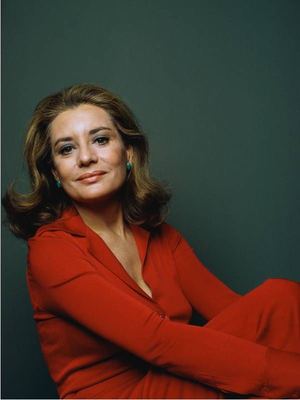 A headshot of Barbara Walters wearing a red outfit. Next Avenue