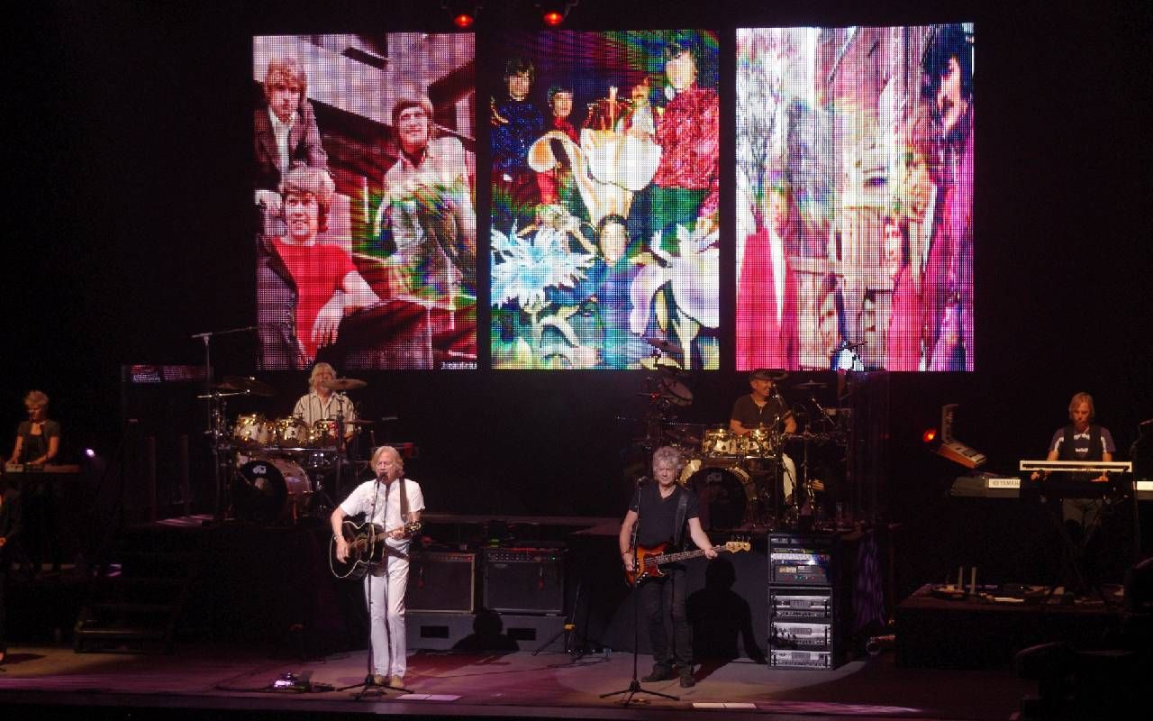 Musicians performing on a stage. Next Avenue, Moody Blues