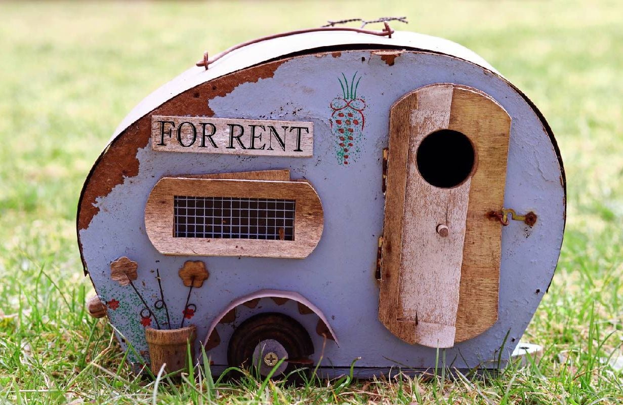 A tiny RV with peeling paint. Next Avenue, bad accommodation, vacation rental nightmare