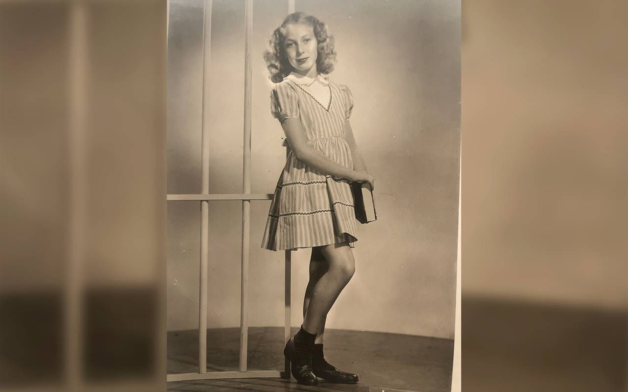 A black and white photo of a young girl wearing tap shoes. Next Avenue, mother, family history