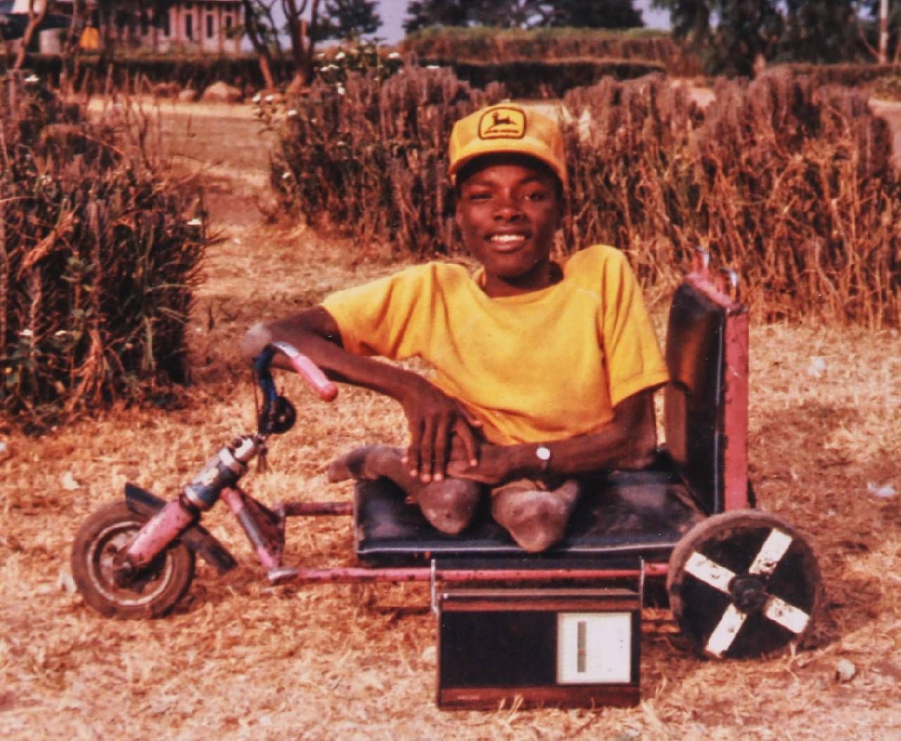 A young person sitting in a small cart. Next Avenue, veteran, transformation