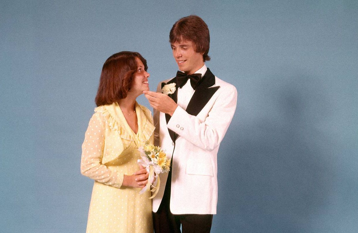 A couple posing for their senior prom in the 1970s. Next Avenue, 50th high school reunion, 1974