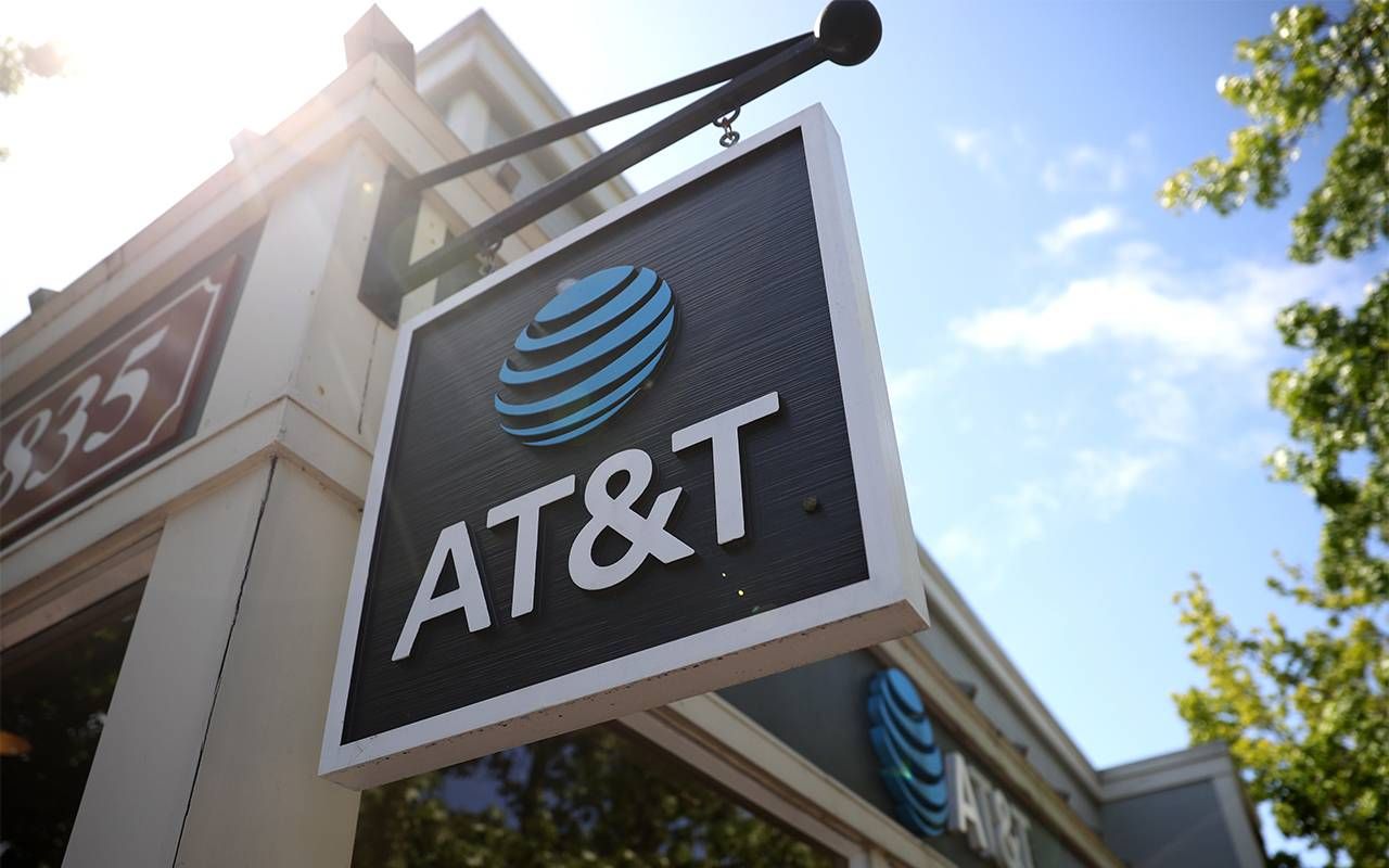 An At&T sign outside of a retail store. Next Avenue, personal data stolen